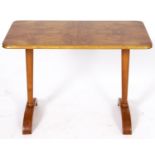 A Scandinavian birch coffee table, 1970's, with quarter veneered top, 55cm h; 45 x 85cm Good