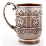 A Scottish Victorian silver christening mug, chased with strapwork and embossed with panels of