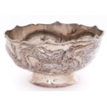 A Chinese silver repousse dragon bowl, early 20th c, the dragon with applied silver wire whiskers on