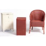 A Lloyd Loom wicker armchair and linen basket, 54cm h, later painted pink and a similar linen basket