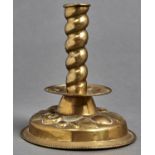 A Flemish sheet brass candlestick, 19th c, in 17th c style, with spiral pillar,  repousse drip pan