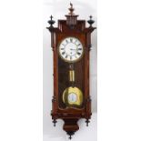 A Viennese mahogany-stained beech cased wall clock, late 19th c, the stepped pediment centred on a