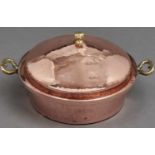 A two handled copper bowl and domed cover, brass knob and heart shaped handles, tinned interior,