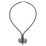 A silver coloured metal ram's head necklace, 47g