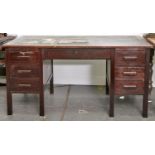 A mahogany pedestal desk, mid 20th c, the top with inset black fabric writing surface above one long