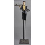 A French painted iron figural dumb waiter,c  mid 20th c, in the form of a butler bearing two