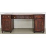 A Regency mahogany bow centre pedestal sideboard, c1820, crossbanded throughout and inlaid with