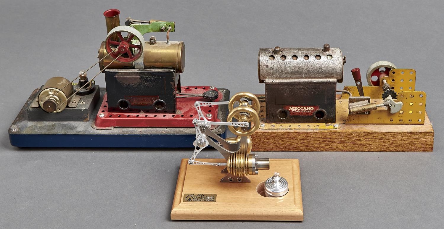 A Bohm Stirling model hot air engine, on varnished lightwood base, 12.5cm h and two Meccano