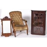 A Victorian walnut nursing chair, c1870, the button back arm pads and serpentine seat upholstered in