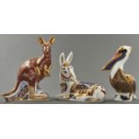 Three Royal Crown Derby Pelican, Kangaroo and Donkey Foal paperweights, 15cm h and smaller,