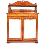 A Victorian mahogany chiffonier, the lower part enclosed by mirrored doors, on turned bun feet,