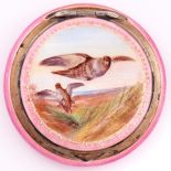 A continental silver gilt and enamel compact, the lid finely painted with flighting grouse