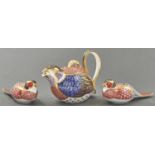 A Royal Crown Derby Imari pattern Partridge teapot and cover and two paperweights, teapot 13.5cm