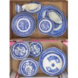 An Alfred Meakin blue printed earthenware Willow pattern dinner service Mostly in good condition