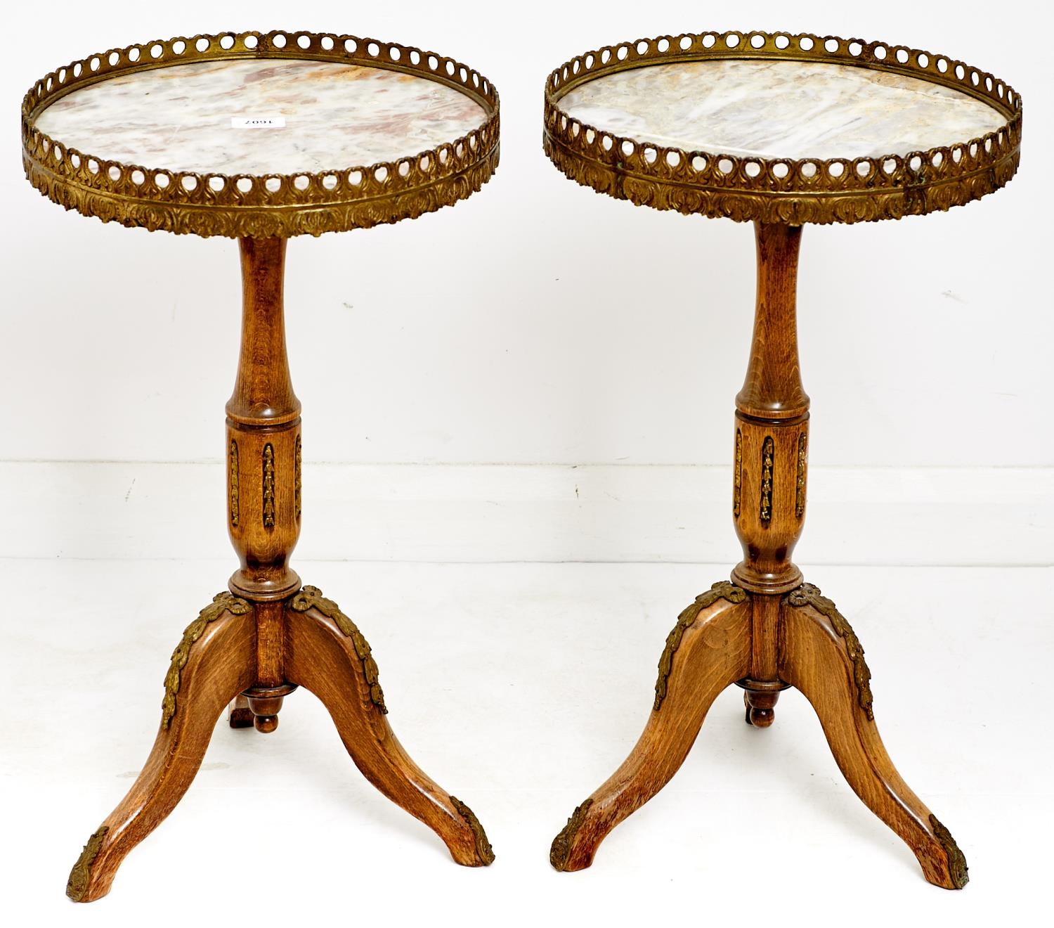 A pair of French giltmetal mounted limed wood tripod tables, with galleried marble top, late 20th c,