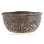 A South East Asian silver repousse sugar bowl, early 20th c, 95mm diam, 2ozs Good condition