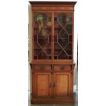 An oak, walnut, mahogany, plane wood and parquetry bookcase, c1900, the cabinet enclosed by