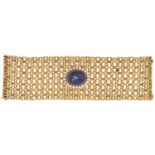 A Jean Renet 18ct gold cuff watch, mechanical movement, with numberless oval lapis lazuli dial and