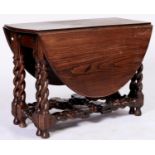 A Victorian oak gateleg table on spiral turned base, 74cm h x 108cm Some minor fading and scuffs but