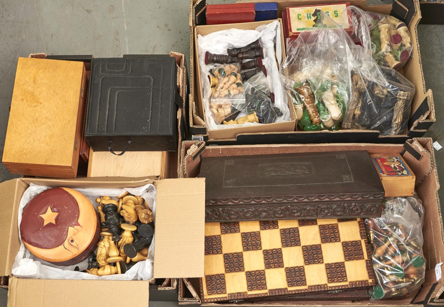 Various sets of chessmen and chess boards, including Chinese style resin reproductions, carved wood,