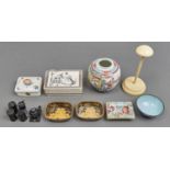 A pair of Chinese black and gold lacquer counter trays, a Herend porcelain cigarette box and