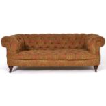 A Victorian Chesterfield sofa, with walnut feet and pottery castors, in buttoned upholstery, seat