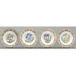 A set of four Coalport botanical plates, outside decorated, c1820, painted with single specimens