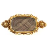 A Georgian gold cannetille mourning brooch, inset hair, 3.6g