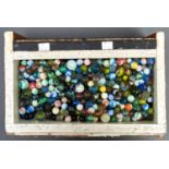 A collection of glass marbles, various sizes, many single, some double swirl, vintage and later