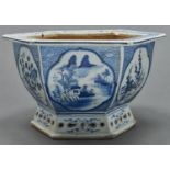 A Chinese hexagonal blue and white jardiniere, Qing dynasty, Qianlong period, the sides painted with