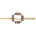 An amethyst and split pearl circlet brooch, early 20th c, in gold, 63mm l, marked 15ct, 5.3g Good