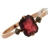 A garnet and diamond ring, in gold marked 9ct, 1.0g, size p