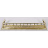 An Edwardian pierced brass fender, c1905, splay fronted beneath gallery, 37 x 126cm Good condition