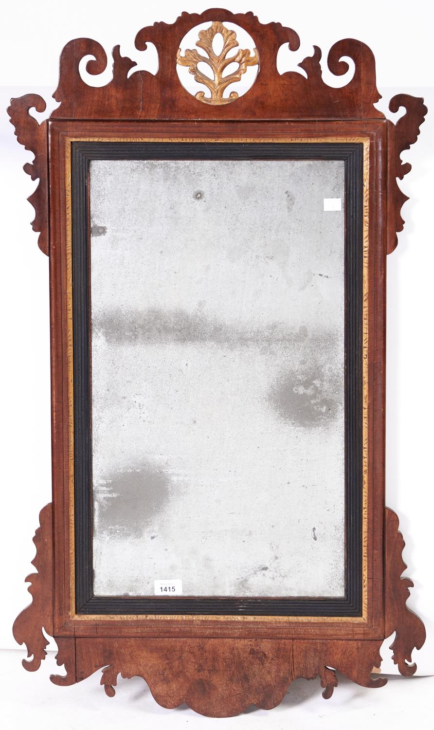 A Victorian walnut and giltwood fretwork mirror, 98 x 57cm Some shrinkage cracks to frame, mirror