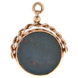 A gold and bloodstone fob swivel, c1900, 40mm, marked 9ct Light wear and dents