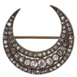 A Victorian diamond crescent brooch, late 19th c, with old cut diamonds mounted in silver and