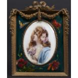 A Continental porcelain plaque, early 20th c, painted with a raven haired beauty and flowers, in