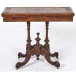 A Victorian inlaid walnut folding card table, with quarter veneered top, turned and carved