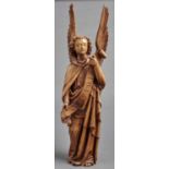 A carved walnut figure of an angel, 19th / 20th c, holding a banner inscribed Alleluia, 77cm h