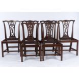 A set of six mahogany dining chairs, c1880, in George II style, foliate carved serpentine cresting