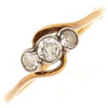 A three stone diamond ring, in gold marked 18ct, 2.1g, size P