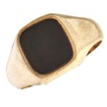 A black onyx signet ring, in 9ct gold, London 1977, 5.9g, size U Slight wear