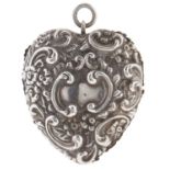 A Victorian heart shaped silver pin cushion, embossed scrolls, flowerheads and leafage, 2.4 x 4.5cm,