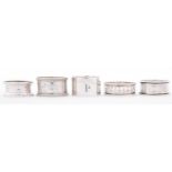 Five silver napkin rings, various makers and dates, two pairs of silver sugar bows and three other