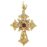 A gold filigree cross set with a synthetic ruby, marked 18k, 2.2g