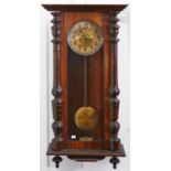 A walnut Vienna wall clock, c1910, pendulum, 91cm h Chapter ring stained, lacks pediment, requires