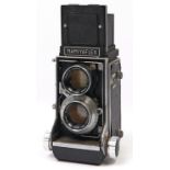 A Mamiyaflex C2 twin lens reflex medium format camera, with Mamiya-Sekor 105mm F3.5 lenses and