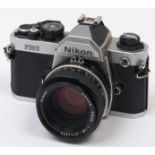 A Nikon FM2 SLR 35mm camera, with Nikon Nikkor 50mm F1.8 lens In apparently working order, wear