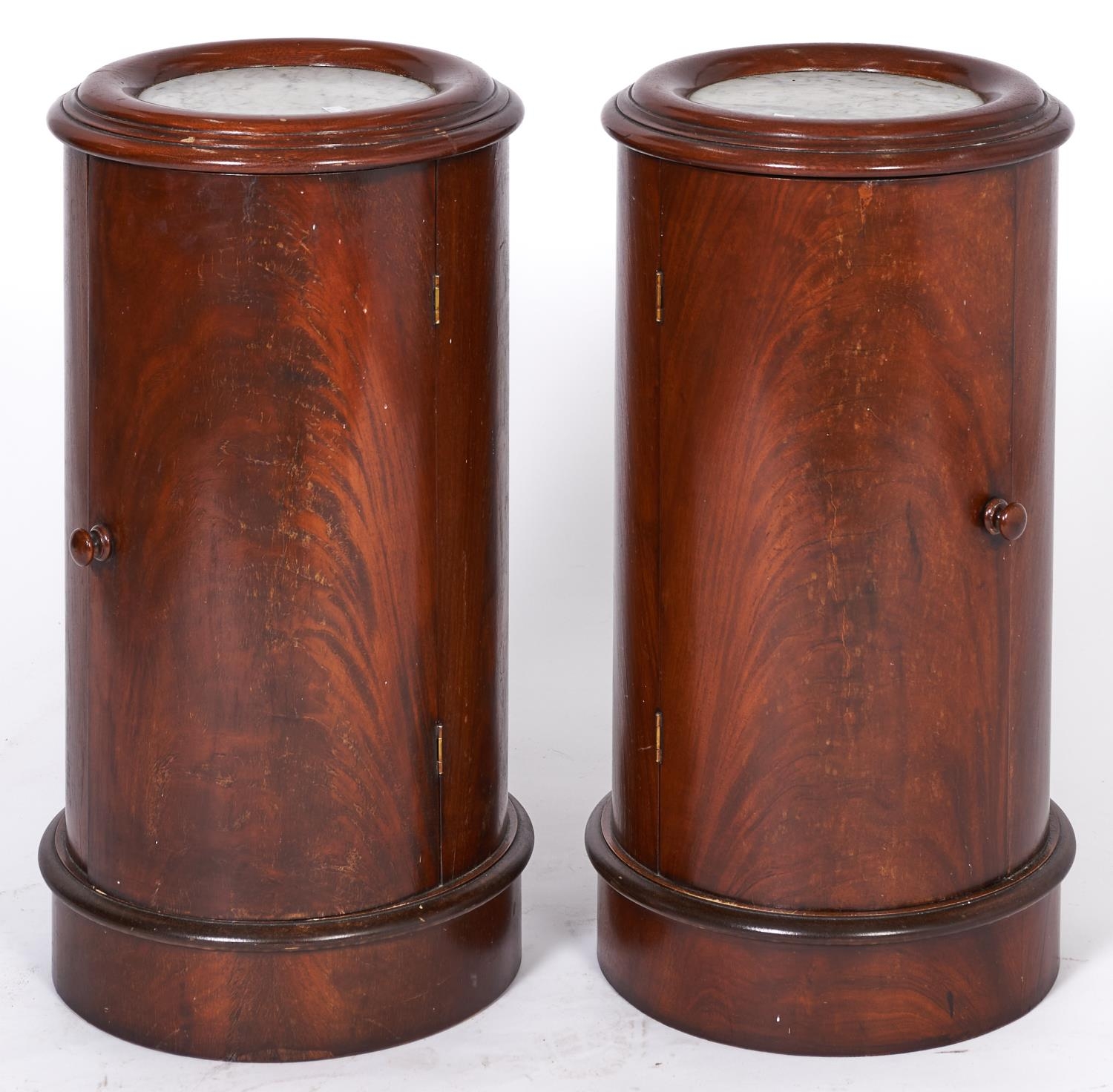 A pair of cylindrical mahogany pot cupboards, 20th c, in Victorian style, with marble inset circular