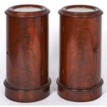 A pair of cylindrical mahogany pot cupboards, 20th c, in Victorian style, with marble inset circular